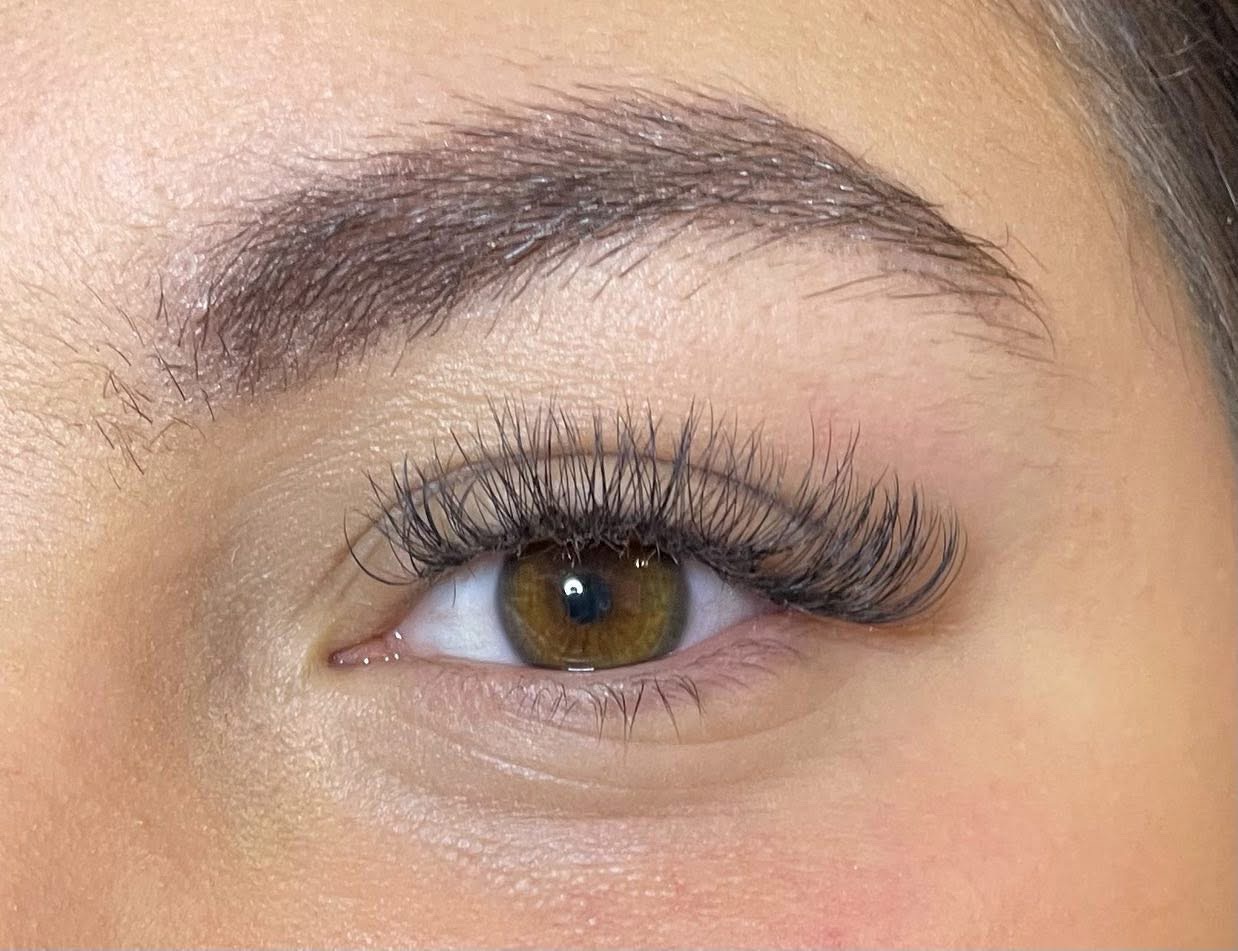 Lash extension close-up on hazel eye